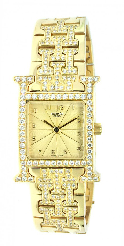 Hermes diamond and 18K yellow gold wristwatch with champagne dial and diamonds set in bezel and bracelet. Estimate: $12,000-$18,000. A.B. Levy’s image.